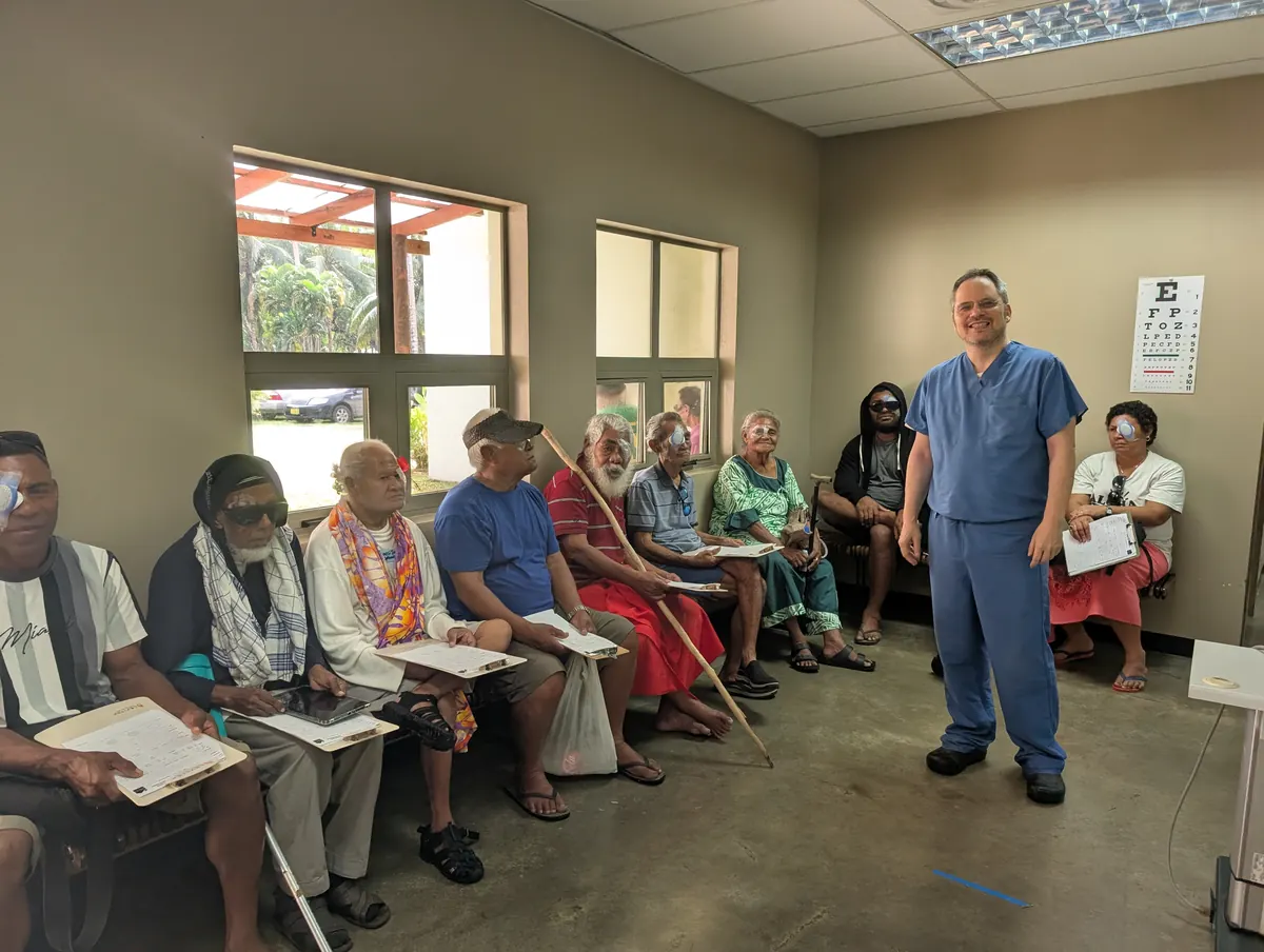 Dr. Kavanagh with patients at a mission eye clinic